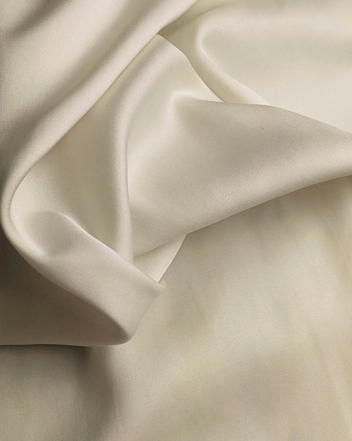 Soft folds of ivory silk